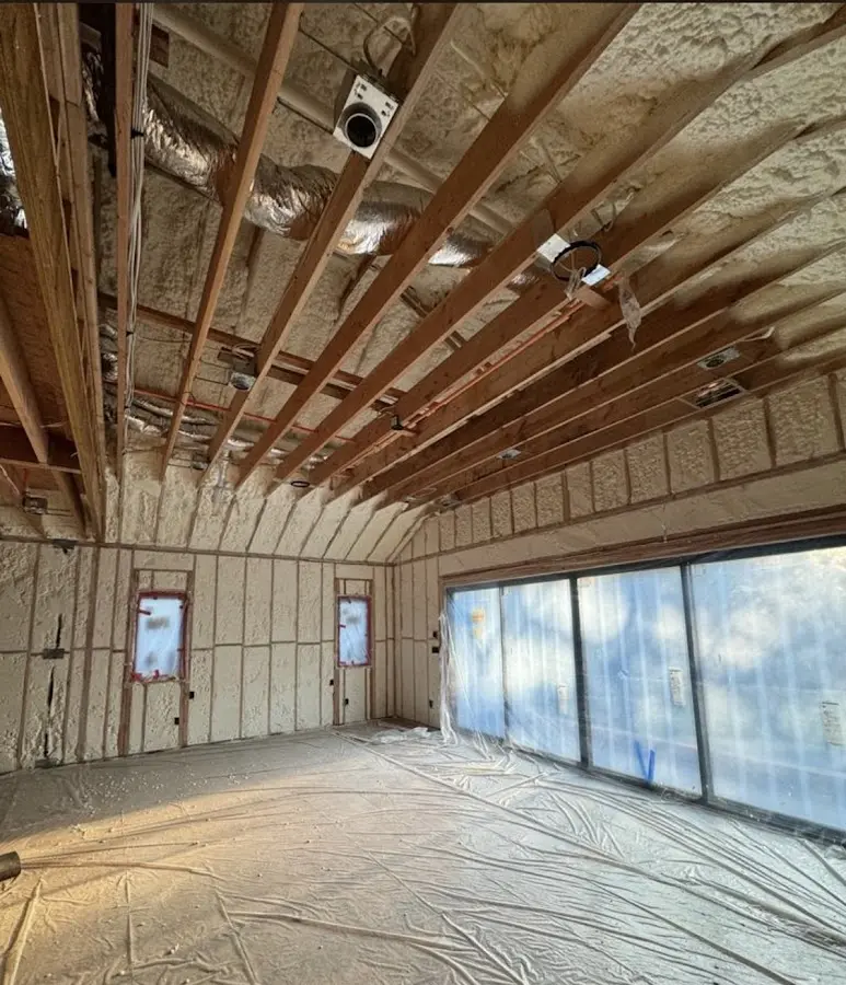 Interior walls and ceiling insulated with spray foam during new construction in West Vincent